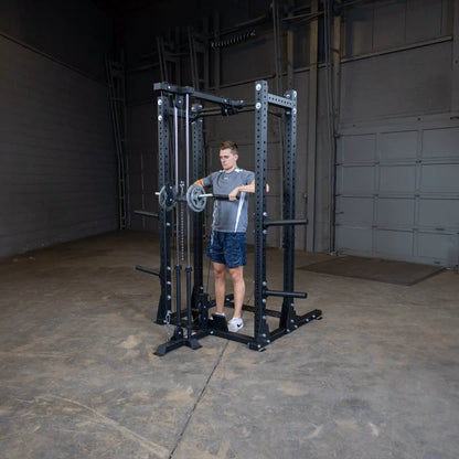 A person using the Body-Solid Pro ClubLine Lat Attachment SPRHLA in a gym setting, demonstrating a lat pull-down exercise.