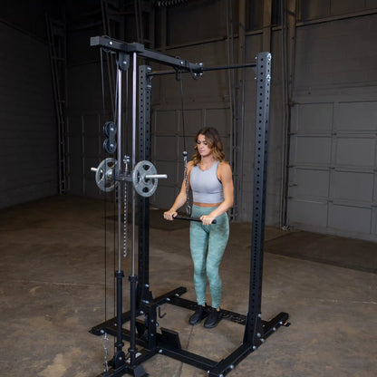 A woman performing an exercise using the Body-Solid Pro ClubLine Lat Attachment SPRHLA in a gym setting, featuring a cable machine with weights.