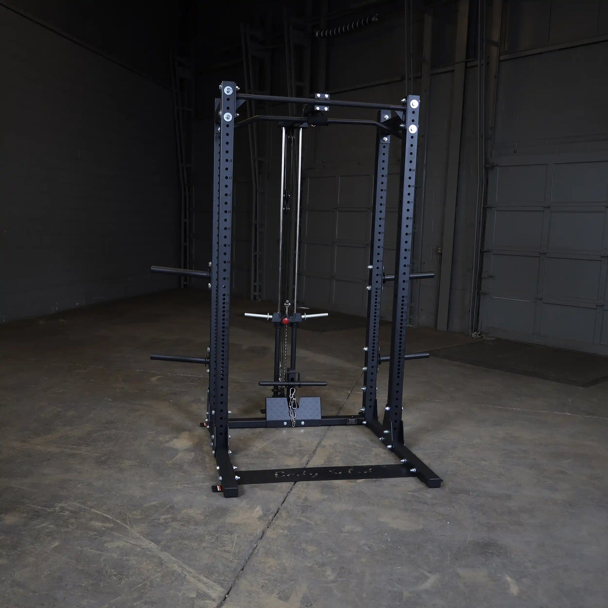 Body-Solid Pro ClubLine Lat Attachment SPRHLA displayed in a spacious gym environment with a concrete floor and minimal background.