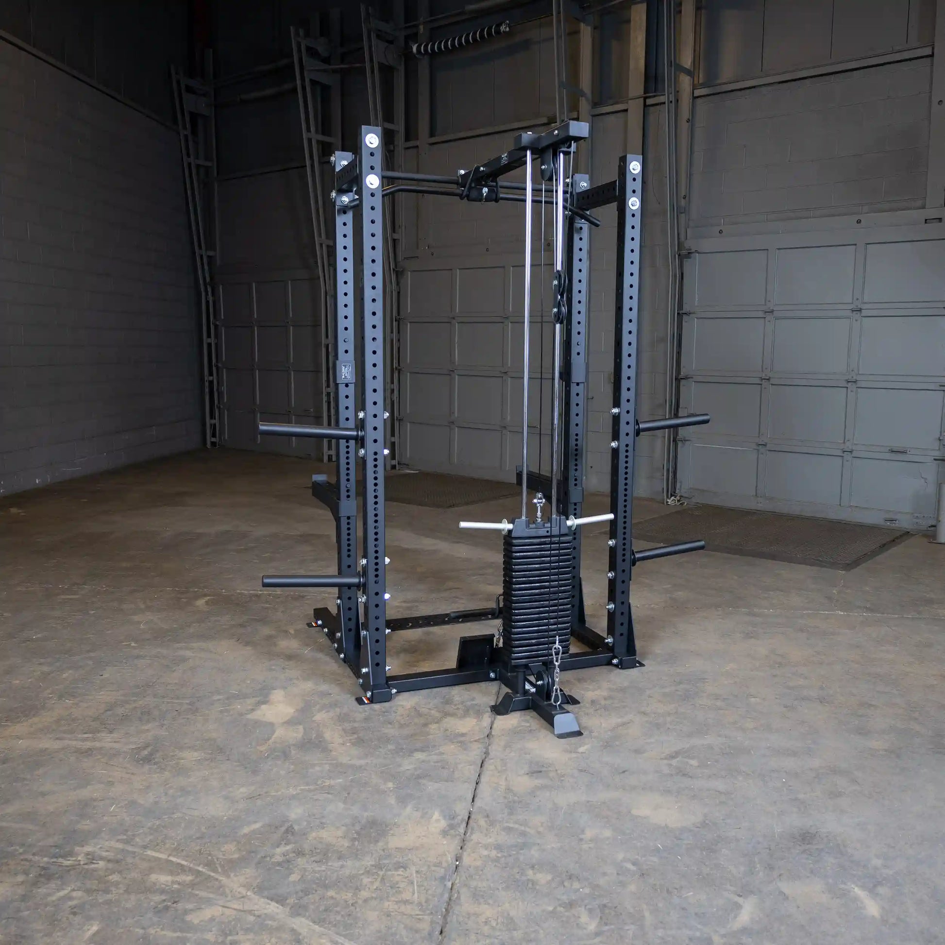 Body-Solid Pro ClubLine Lat Attachment SPRHLA displayed in an empty gym space, featuring a black frame with a weight stack and adjustable pulleys.
