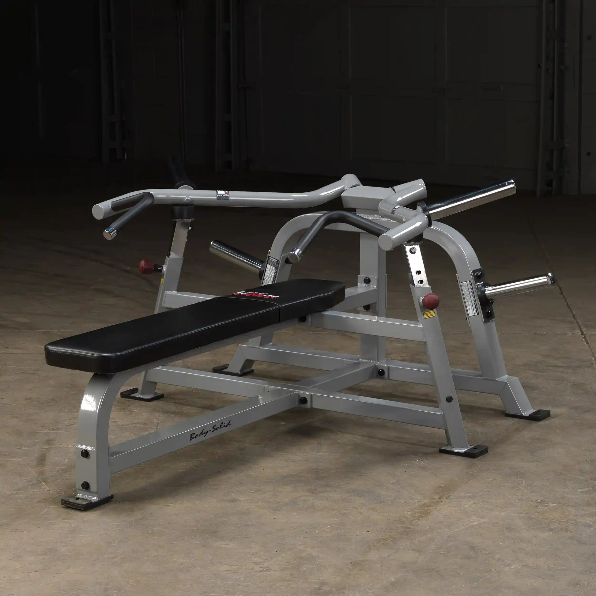Body-Solid Pro ClubLine Leverage Bench Press LVBP, featuring a sturdy design with a padded bench and adjustable handles, set against a dark background.