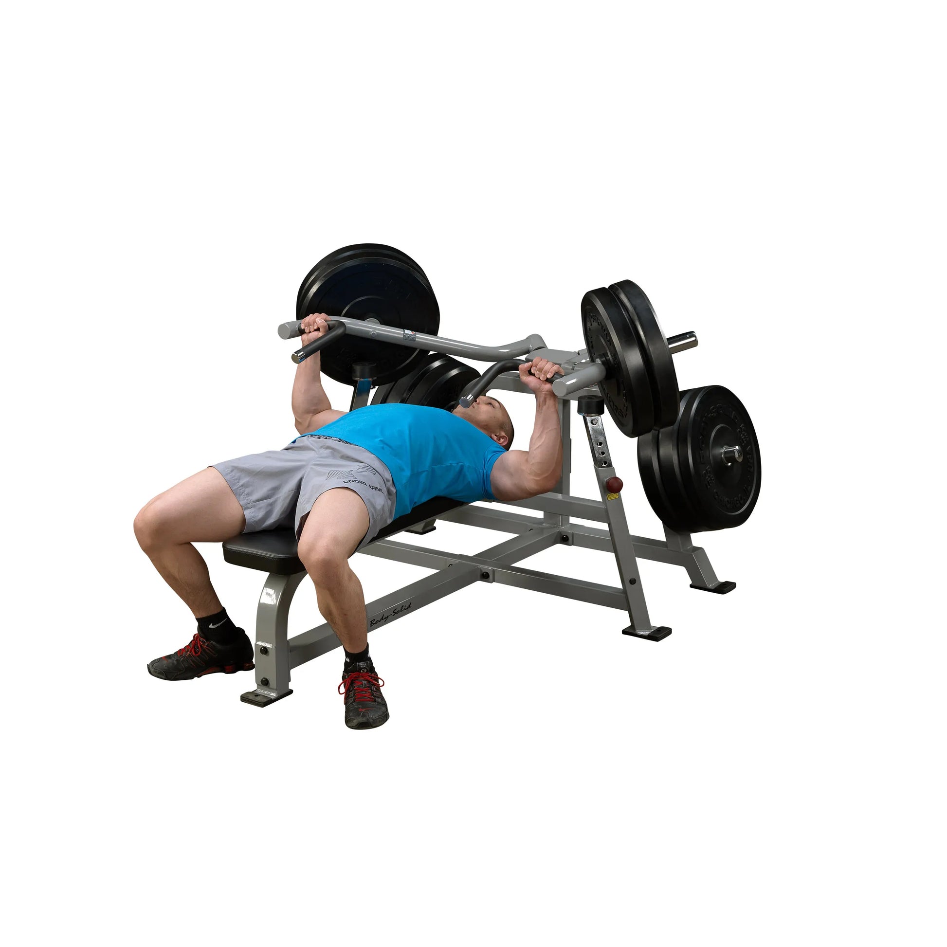 A person performing a bench press exercise on the Body-Solid Pro ClubLine Leverage Bench Press LVBP, with a barbell loaded with weights.