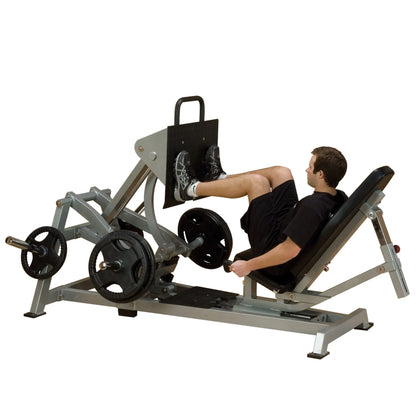 Body-Solid Pro ClubLine Leverage Horizontal Leg Press Machine LVLP being used by a man in athletic wear, demonstrating leg press exercise.