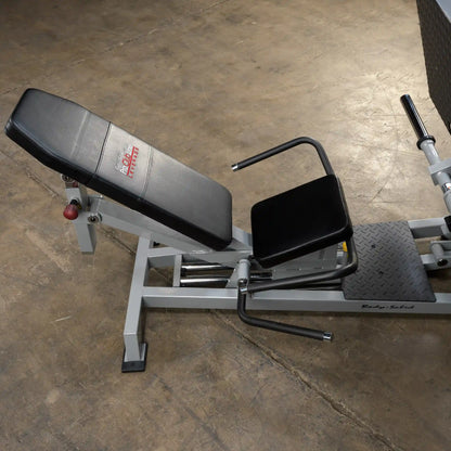 Body-Solid Pro ClubLine Leverage Horizontal Leg Press Machine LVLP with padded seats and adjustable footrests, positioned on a gym floor.