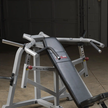 Body-Solid Pro ClubLine Leverage Incline Press LVIP, featuring a padded bench and handlebars, set in a gym environment with a concrete floor.