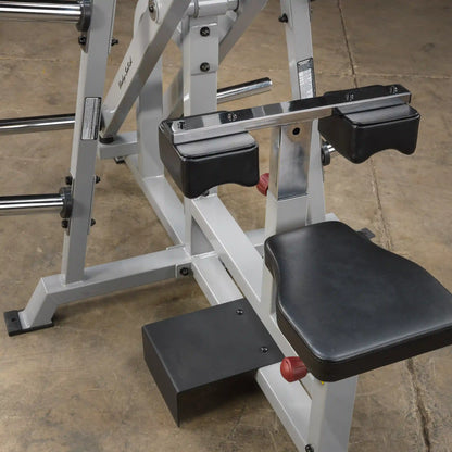Close-up view of the Body-Solid Pro ClubLine Leverage Lat Pulldown Machine LVLA, showcasing the seat and arm supports.