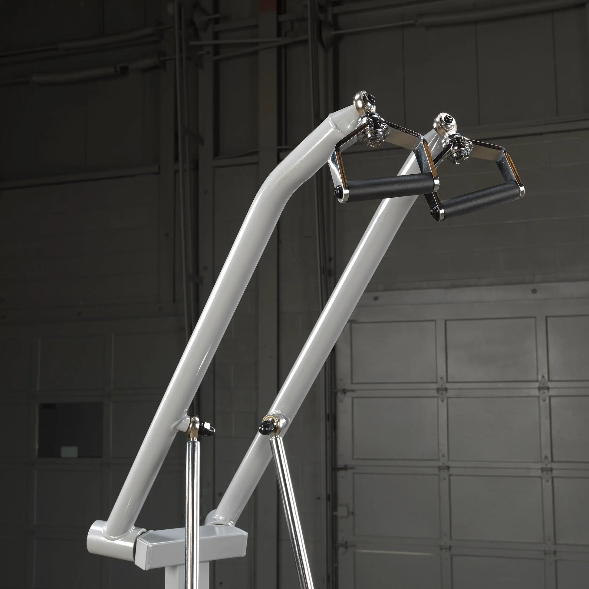Close-up view of the Body-Solid Pro ClubLine Leverage Lat Pulldown Machine LVLA, highlighting the pulldown arms and grips.