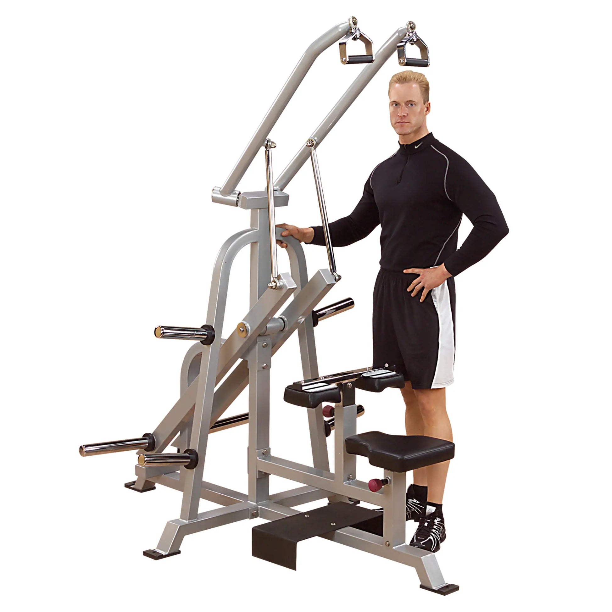 A person stands next to the Body-Solid Pro ClubLine Leverage Lat Pulldown Machine LVLA, showcasing its design and features.
