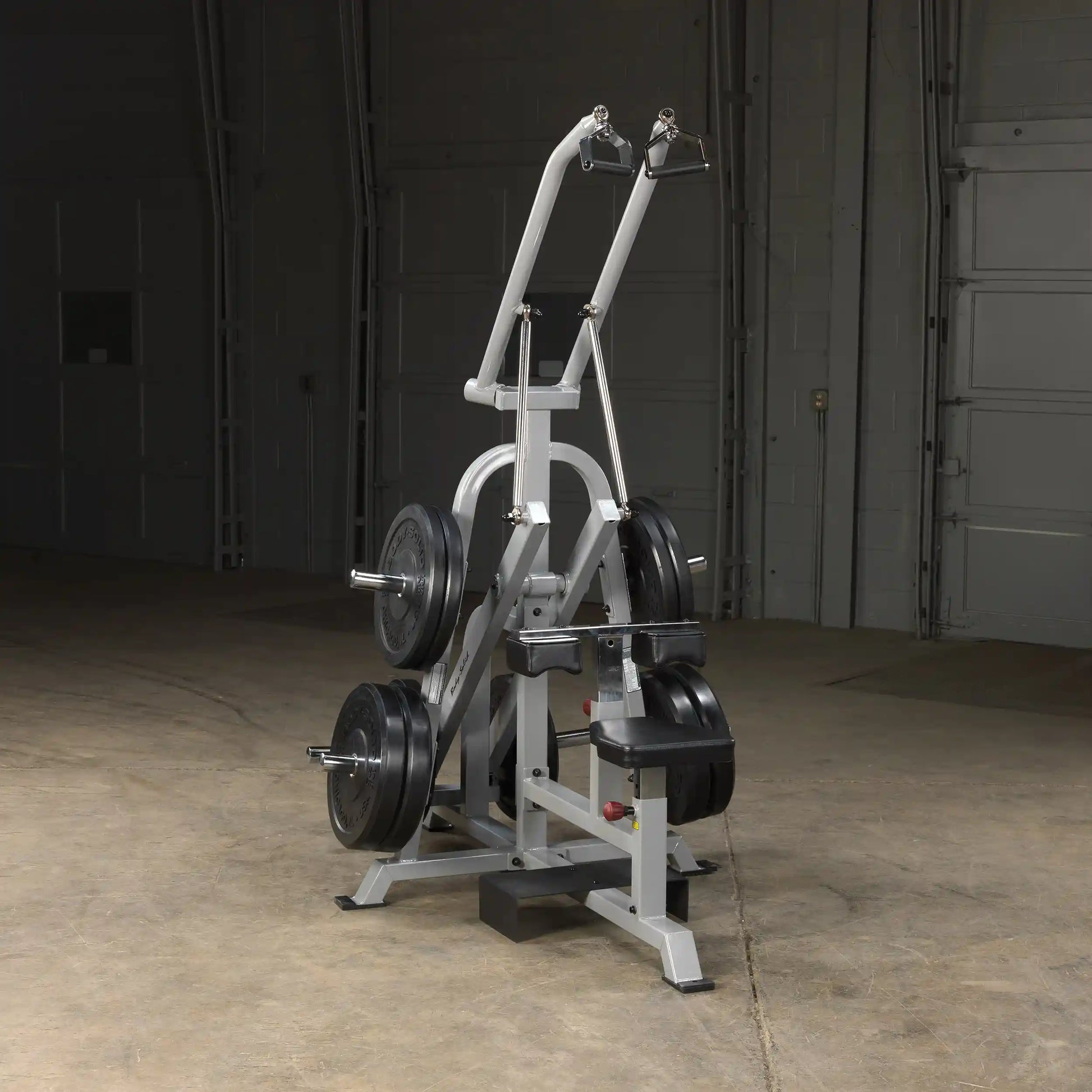 Body-Solid Pro ClubLine Leverage Lat Pulldown Machine LVLA displayed in a gym setting with weights attached.