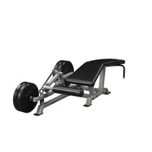 Body-Solid Pro ClubLine Leverage Leg Curl Machine LVLC, featuring a sturdy frame, padded bench, and weight plates for leg workout exercises.