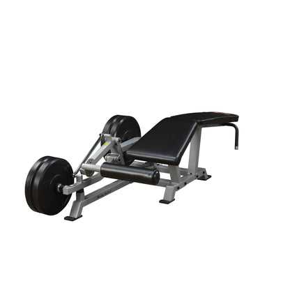 Body-Solid Pro ClubLine Leverage Leg Curl Machine LVLC, featuring a sturdy frame, padded bench, and weight plates for leg workout exercises.