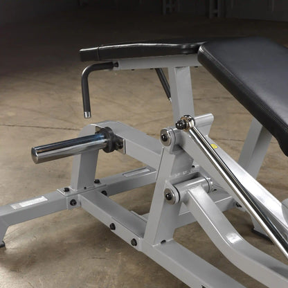 Close-up view of the Body-Solid Pro ClubLine Leverage Leg Curl Machine LVLC, showcasing its adjustable components and sturdy construction.