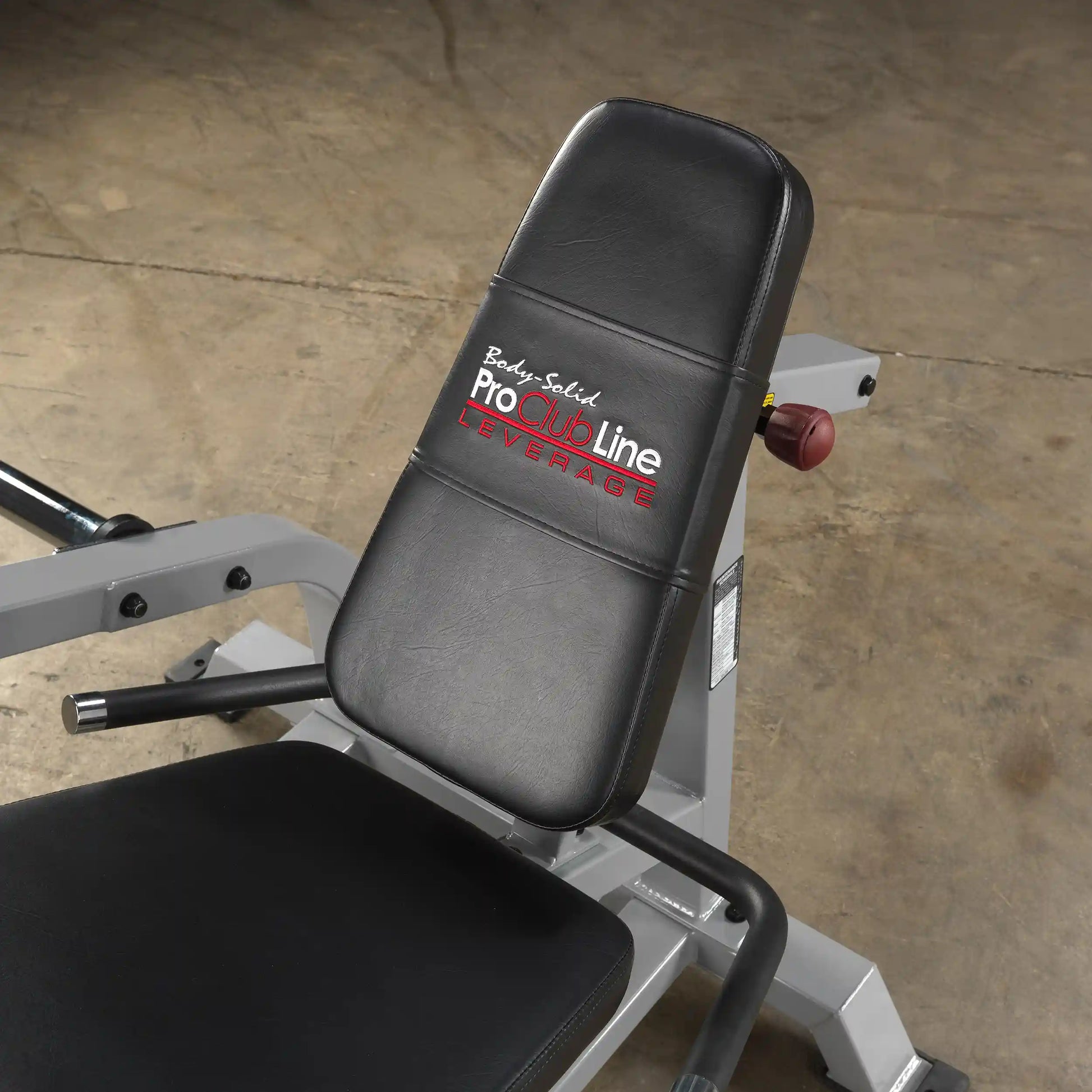 Close-up of the Body-Solid Pro ClubLine Leverage Leg Extension Machine LVLE, featuring a padded seat and backrest in black leather.
