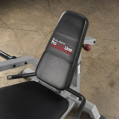 Close-up of the Body-Solid Pro ClubLine Leverage Leg Extension Machine LVLE, featuring a padded seat and backrest in black leather.