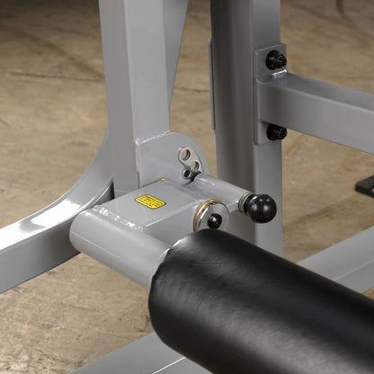 Close-up of the Body-Solid Pro ClubLine Leverage Leg Extension Machine LVLE, highlighting the adjustable components and padded support.