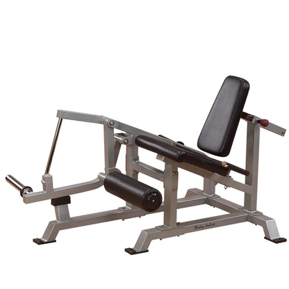 Body-Solid Pro ClubLine Leverage Leg Extension Machine LVLE, featuring a padded seat and leg rollers, designed for leg extension exercises in a gym setting.