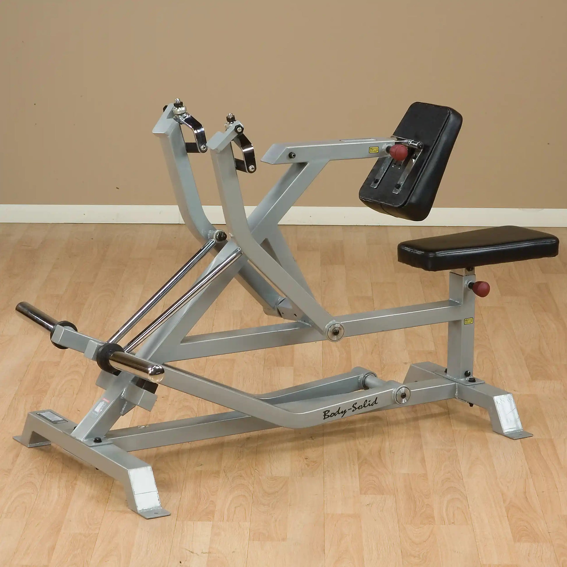 Body-Solid Pro ClubLine Leverage Seated Row Machine LVSR, featuring adjustable seat and handles, designed for strength training in a gym setting.