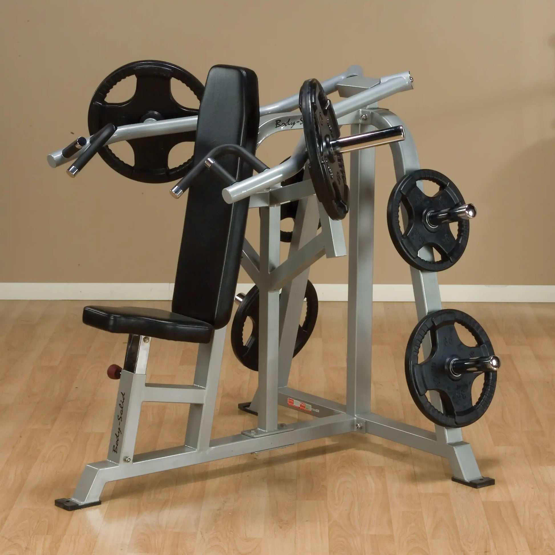 Body-Solid Pro ClubLine Leverage Shoulder Press Machine LVSP, featuring a sturdy frame, padded seat, and weight plates on either side, set against a neutral background.
