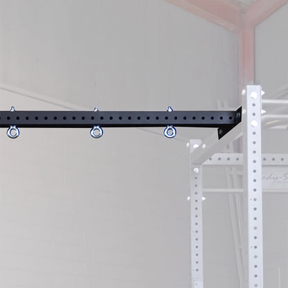 Body-Solid Pro ClubLine Power Rack Connecting Bar SPRACB attached to a white power rack frame, featuring multiple anchor points for added versatility.