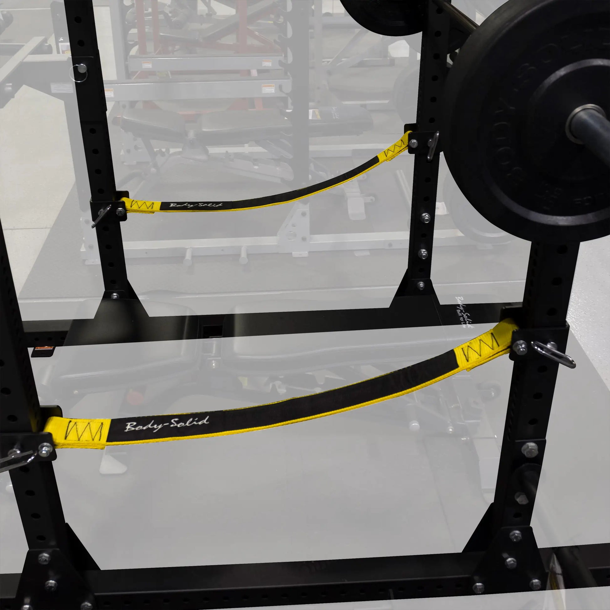 Close-up of Body-Solid Pro ClubLine Power Rack Safety Straps SPRSS installed on a power rack, showcasing the black and yellow design.