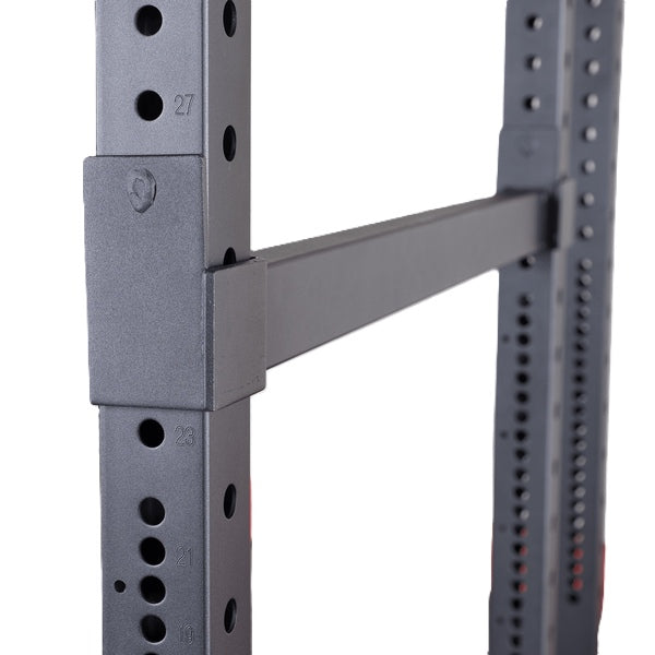 Close-up view of the Body-Solid Pro ClubLine Premium Safeties SPRSF, showcasing the adjustable safety bar and numbered holes on the rack.