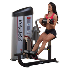 A woman using the Body-Solid Pro ClubLine Series 2 Ab & Back Machine S2ABB, demonstrating an ab workout with proper form.