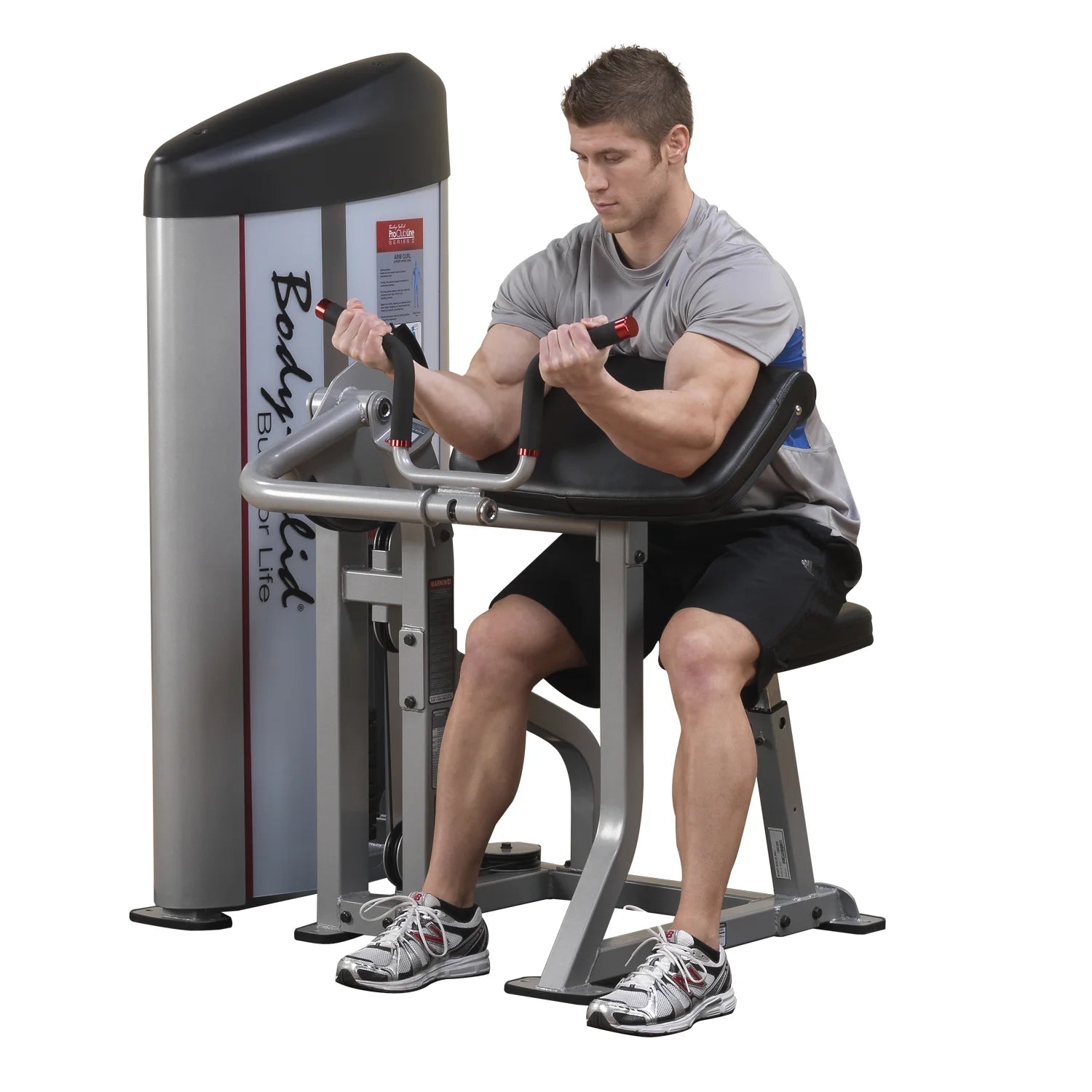 A person using the Body-Solid Pro ClubLine Series 2 Arm Curl Machine S2AC, performing arm curls in a gym setting.