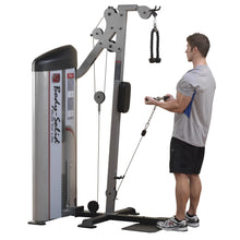 A person using the Body-Solid Pro ClubLine Series 2 Bicep & Tricep Machine S2BTP, performing an exercise with a rope attachment, in a gym setting.