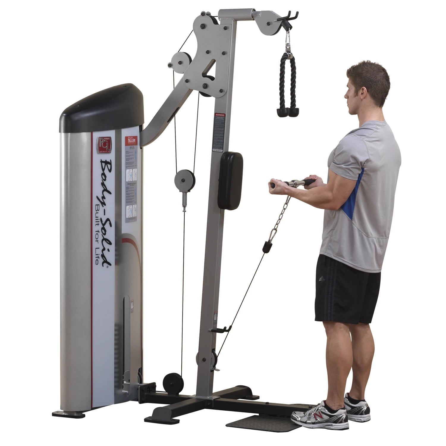 A person using the Body-Solid Pro ClubLine Series 2 Bicep & Tricep Machine S2BTP, performing an exercise with a rope attachment, in a gym setting.