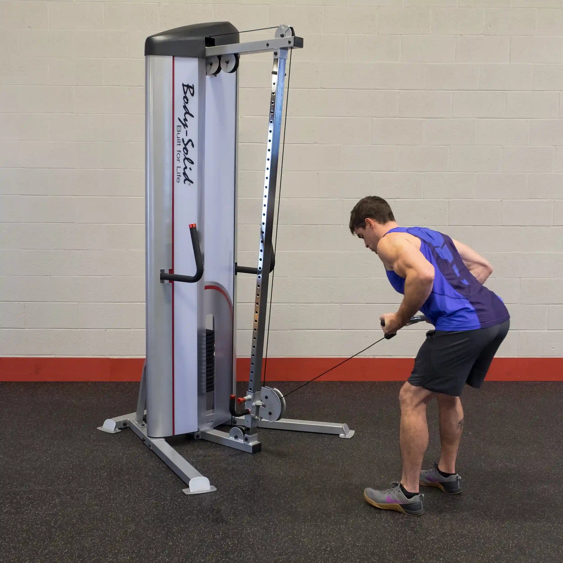 A person using the Body-Solid Pro ClubLine Series 2 Cable Column S2CC for a cable workout in a gym setting.