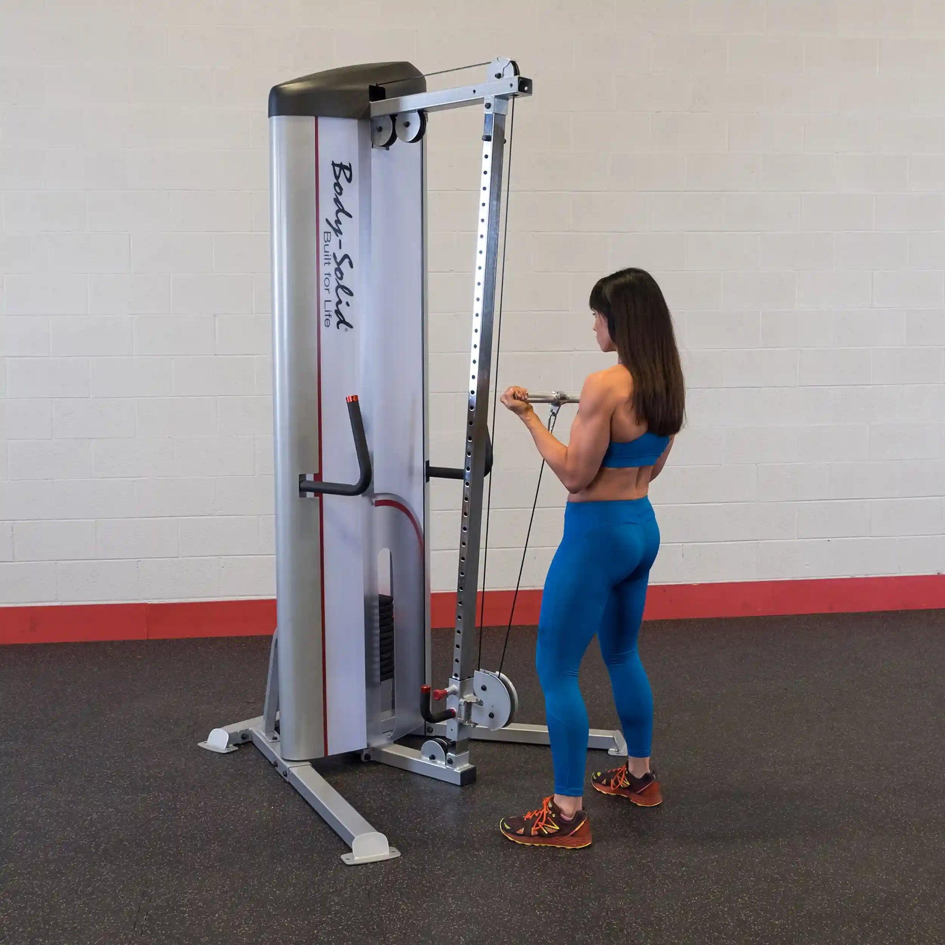 A person using the Body-Solid Pro ClubLine Series 2 Cable Column S2CC in a gym setting, performing a cable exercise.