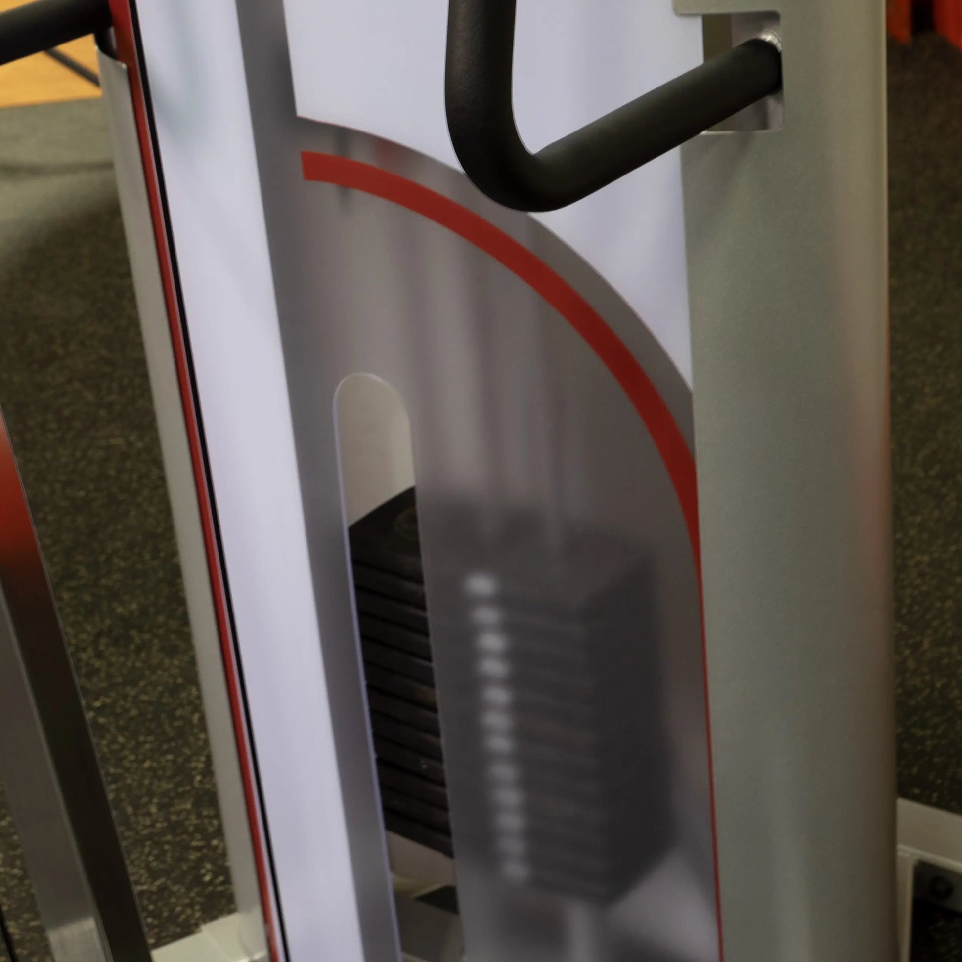 Close-up view of the Body-Solid Pro ClubLine Series 2 Cable Column S2CC, showcasing the weight stack and handle grips against a textured gym floor background.