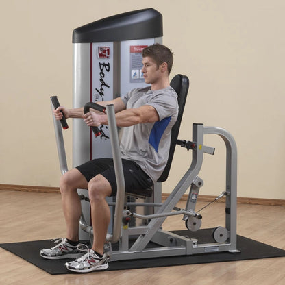 A person using the Body-Solid Pro ClubLine Series 2 Chest Press Machine S2CP, performing a chest press exercise in a gym setting.