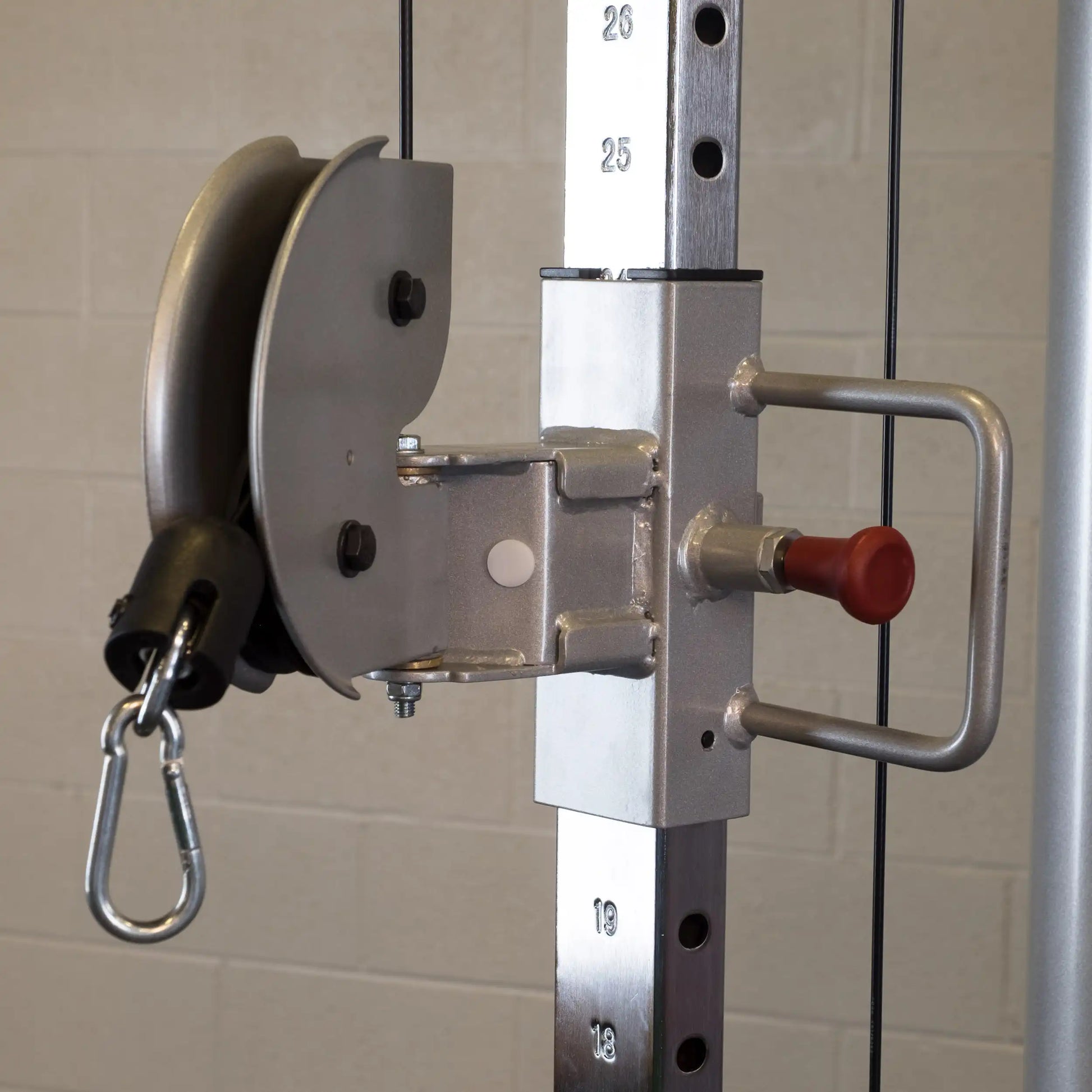 Close-up of the pulley system on the Body-Solid Pro ClubLine Series 2 Functional Trainer S2FT, showcasing the adjustable weight stack and metal components.
