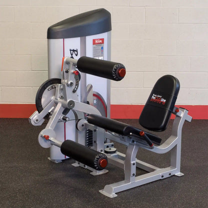 Body-Solid Pro ClubLine Series 2 Leg Extension & Leg Curl Machine S2LEC, featuring adjustable leg pads and a sturdy frame, designed for effective leg workouts in a gym setting.