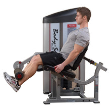 A person using the Body-Solid Pro ClubLine Series 2 Leg Extension Machine S2LEX, performing leg extensions in a gym setting.