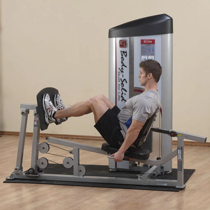 A man performing a leg press exercise on the Body-Solid Pro ClubLine Series 2 Leg Press & Calf Raise Machine S2LPC in a gym setting.
