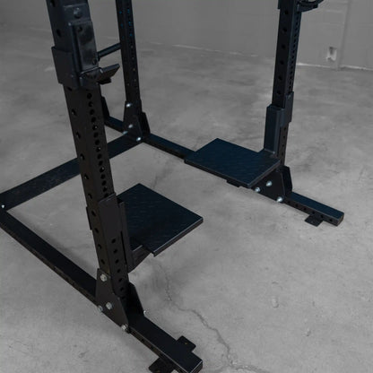 Close-up view of the Body-Solid Pro ClubLine Spotter Platforms SPRSP, featuring sturdy black platforms designed for weightlifting support.