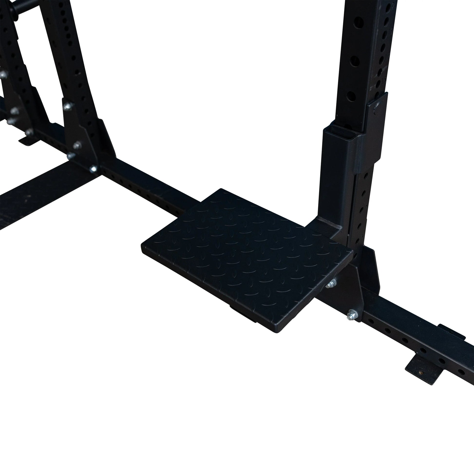Close-up of the Body-Solid Pro ClubLine Spotter Platforms SPRSP attached to a weight training rack, featuring a textured surface for added grip and stability.