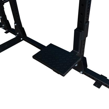 Close-up of the Body-Solid Pro ClubLine Spotter Platforms SPRSP attached to a weight training rack, featuring a textured surface for added grip and stability.