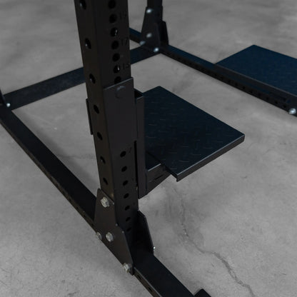 Close-up of the Body-Solid Pro ClubLine Spotter Platforms SPRSP, highlighting the textured foot platforms attached to the frame.