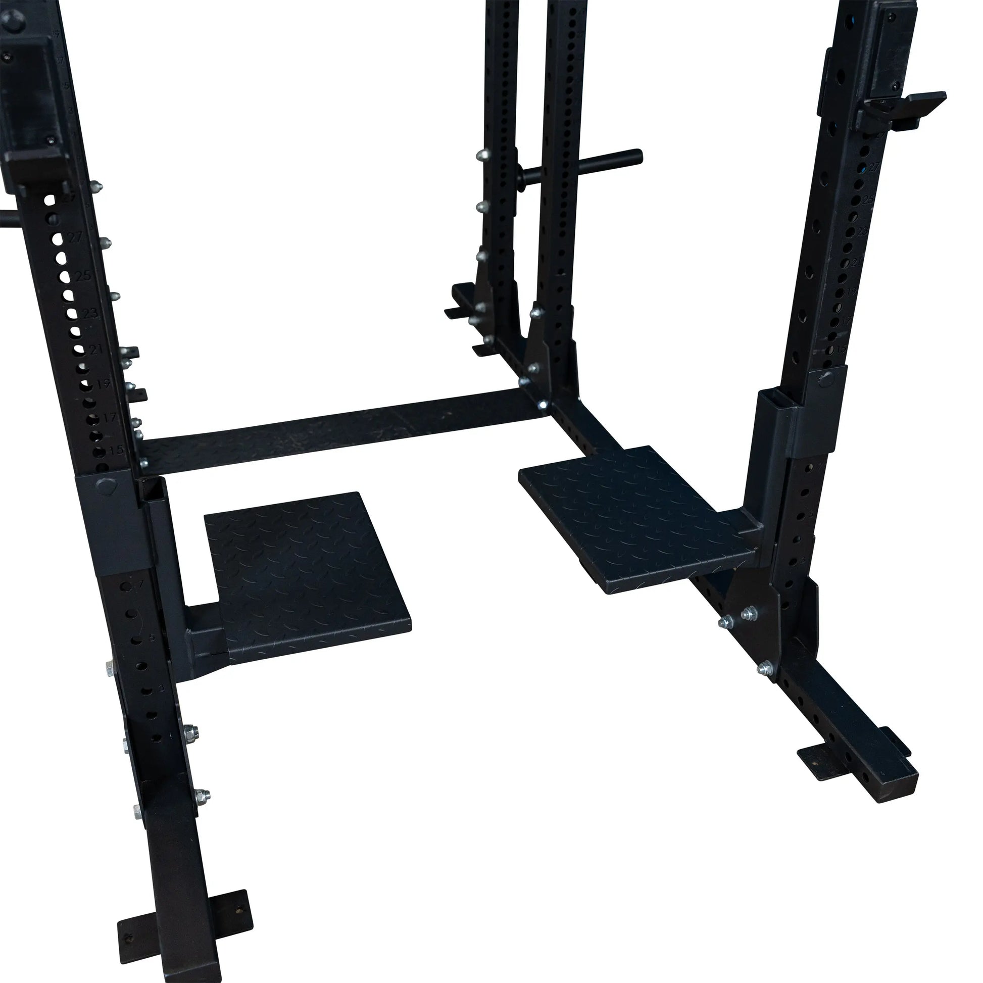 Body-Solid Pro ClubLine Spotter Platforms SPRSP displayed in a gym setting, featuring sturdy black platforms designed for safety and support during weightlifting exercises.