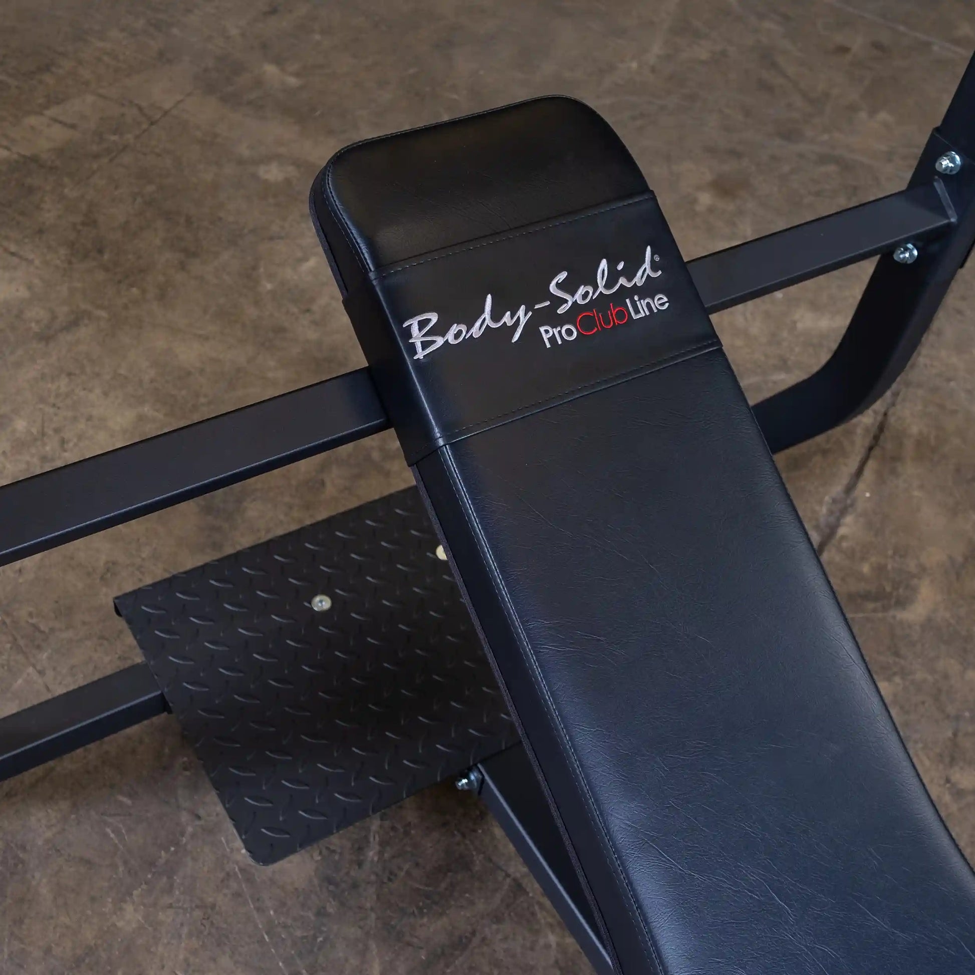 Close-up view of the Body-Solid Pro Clubline Incline Olympic Bench SOIB250, showcasing the padded seat and logo.