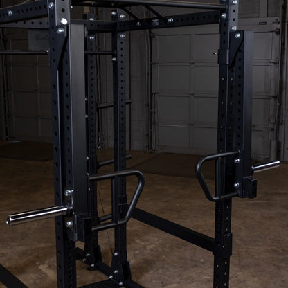 Close-up view of the Body-Solid Pro Clubline Jammer Arms SPRJAM mounted on a pull-up rack, showcasing the black frame and sturdy construction.
