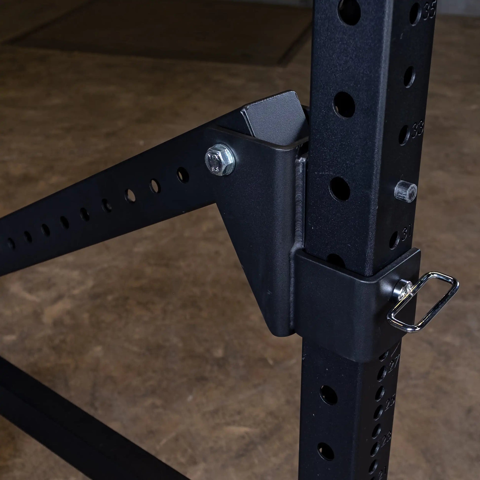 Close-up view of the Body-Solid Pro Clubline Jammer Arms SPRJAM mounted on a power rack, showcasing the adjustable hardware and attachment points.