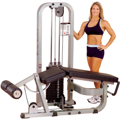 Body-Solid Pro Clubline Leg Curl Machine SLC400G with a woman in athletic wear standing beside it, showcasing the machine's design and features.