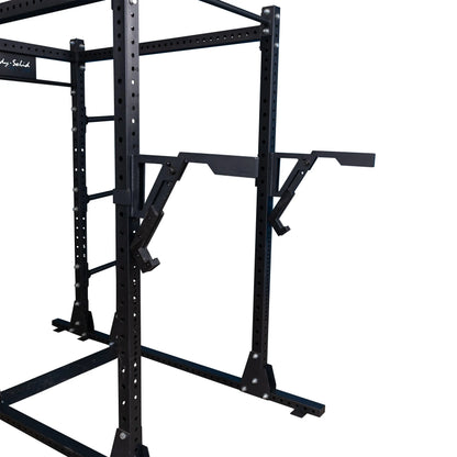 Close-up view of the Body-Solid Pro Clubline Monolift Attachment SPRLFT, showcasing its robust black frame and adjustable supports designed for weightlifting equipment.