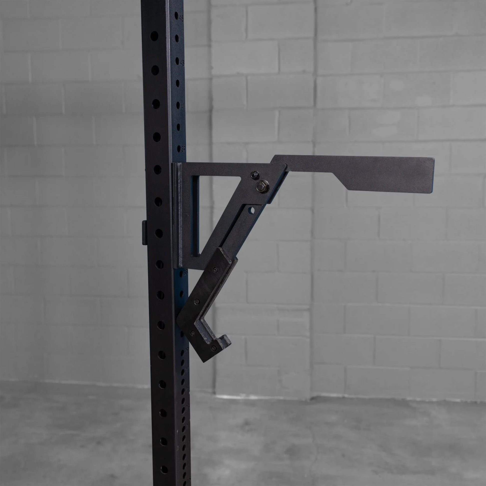 Body-Solid Pro Clubline Monolift Attachment SPRLFT mounted on a squat rack, featuring a sturdy black steel design and adjustable positioning.