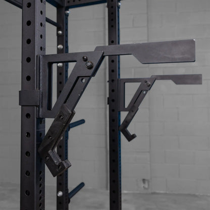 Close-up of the Body-Solid Pro Clubline Monolift Attachment SPRLFT mounted on a squat rack, showcasing its robust design and adjustment features.