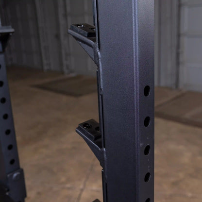 Close-up view of the Body-Solid Pro Clubline Shoulder Olympic Bench SOSB250 showing the vertical support structure with adjustable height holes.